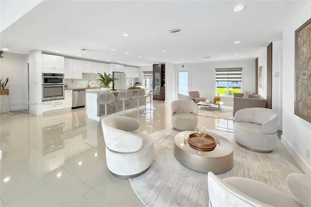 8195 SW 151st St, Palmetto Bay, FL 33158 - living area featuring visible vents, recessed lighting, baseboards, and light tile patterned floors