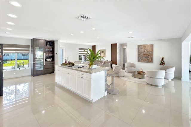 8195 SW 151st St, Palmetto Bay, FL 33158 - kitchen featuring light tile patterned floors, white cabinets, recessed lighting, and visible vents