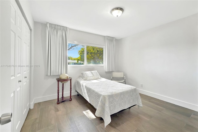 8195 SW 151st St, Palmetto Bay, FL 33158 - bedroom featuring baseboards, a closet, and wood finished floors