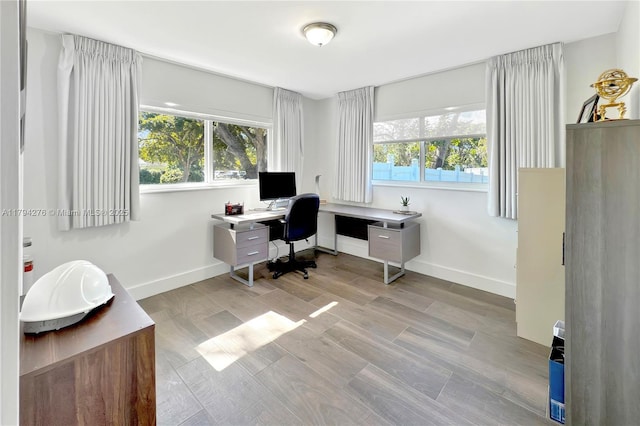 8195 SW 151st St, Palmetto Bay, FL 33158 - home office featuring baseboards, wood finished floors, and a healthy amount of sunlight