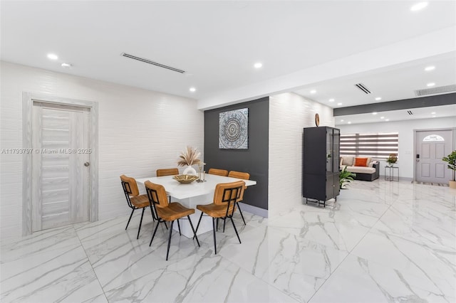 dining space featuring visible vents, recessed lighting, and marble finish floor