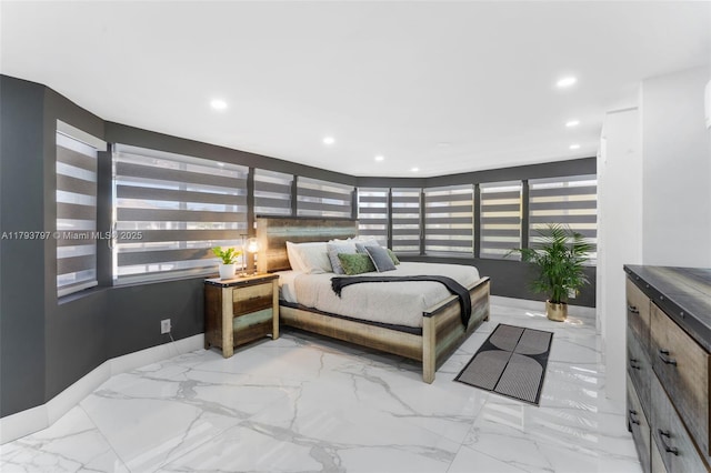 bedroom featuring recessed lighting, marble finish floor, baseboards, and multiple windows