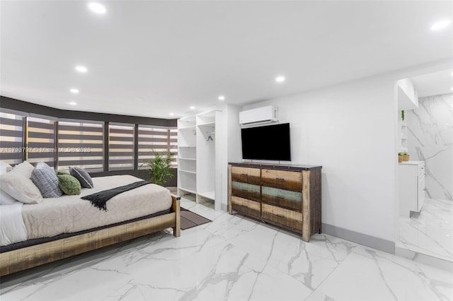 bedroom featuring recessed lighting, baseboards, marble finish floor, and a wall mounted air conditioner