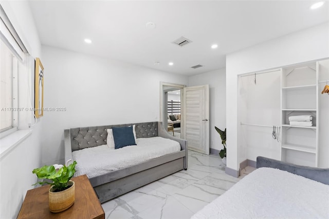 bedroom featuring visible vents, recessed lighting, and marble finish floor