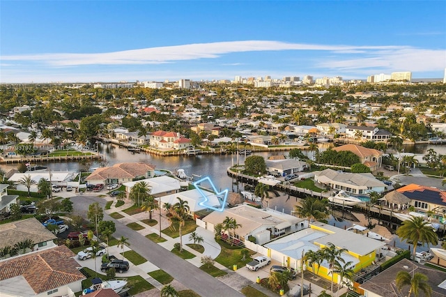 bird's eye view featuring a water view and a residential view
