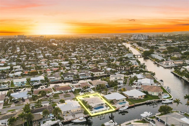 aerial view with a water view and a residential view
