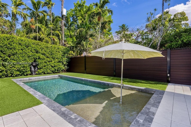 712 NE 72nd St, Miami, FL 33138 - view of front of house featuring driveway, a front yard, and stucco siding