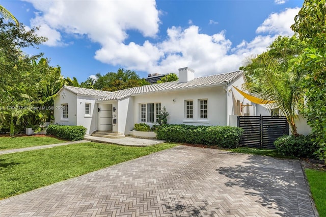 712 NE 72nd St, Miami, FL 33138 - living room featuring arched walkways, vaulted ceiling with beams, wood ceiling, and a notable chandelier