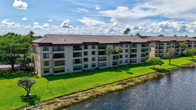 view of building exterior with a water view