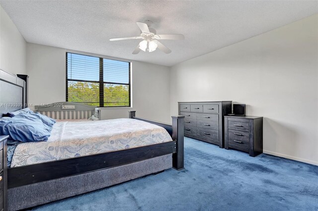 bedroom with carpet floors, baseboards, a ceiling fan, and a textured ceiling