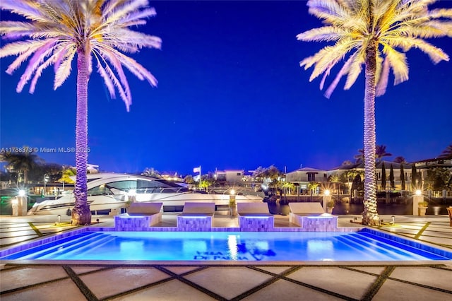 600 Isle Of Palms Dr, Fort Lauderdale, FL 33301 - pool at night with a patio and an outdoor pool