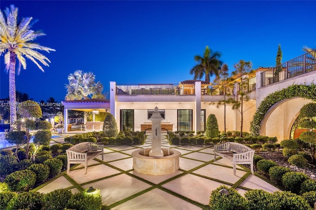 600 Isle Of Palms Dr, Fort Lauderdale, FL 33301 - patio at twilight with a balcony