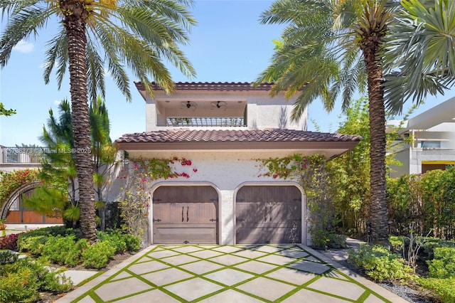 600 Isle Of Palms Dr, Fort Lauderdale, FL 33301 - mediterranean / spanish home featuring a garage, stucco siding, a balcony, and driveway