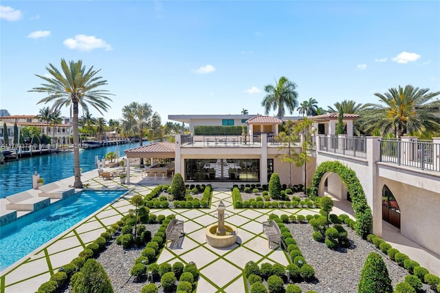 600 Isle Of Palms Dr, Fort Lauderdale, FL 33301 - exterior space with a water view, an outdoor pool, a patio area, and stucco siding