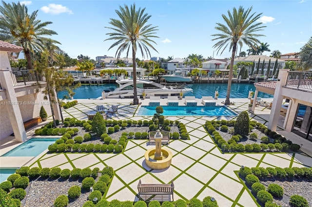 600 Isle Of Palms Dr, Fort Lauderdale, FL 33301 - view of swimming pool featuring a boat dock, a water view, and a patio