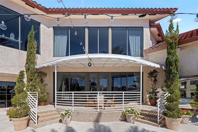 600 Isle Of Palms Dr, Fort Lauderdale, FL 33301 - rear view of house with a porch and stucco siding