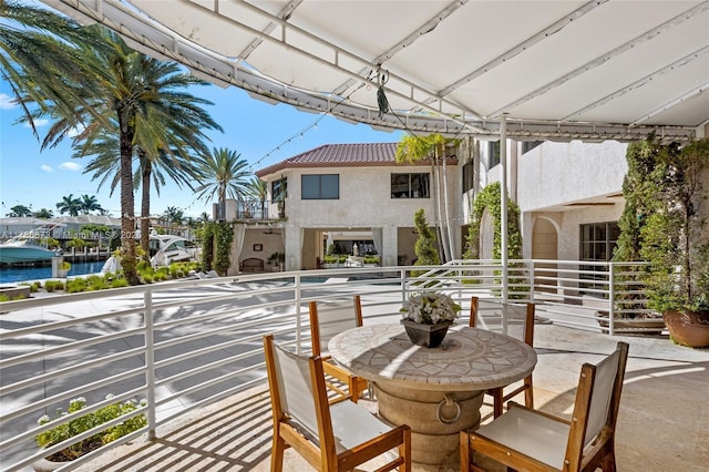 600 Isle Of Palms Dr, Fort Lauderdale, FL 33301 - view of patio / terrace with a water view and a balcony