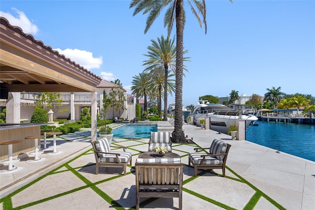 600 Isle Of Palms Dr, Fort Lauderdale, FL 33301 - view of patio / terrace with a water view and an outdoor pool