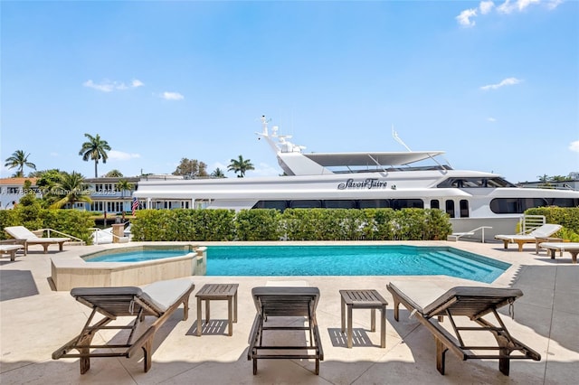 600 Isle Of Palms Dr, Fort Lauderdale, FL 33301 - view of pool featuring a patio and a pool with connected hot tub