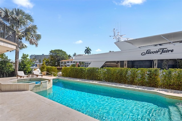 600 Isle Of Palms Dr, Fort Lauderdale, FL 33301 - view of swimming pool with a pool with connected hot tub and a patio area