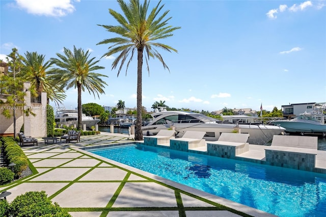 600 Isle Of Palms Dr, Fort Lauderdale, FL 33301 - outdoor pool with a patio area and a boat dock