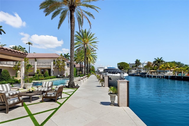 600 Isle Of Palms Dr, Fort Lauderdale, FL 33301 - exterior space featuring a community pool, a water view, and a patio area