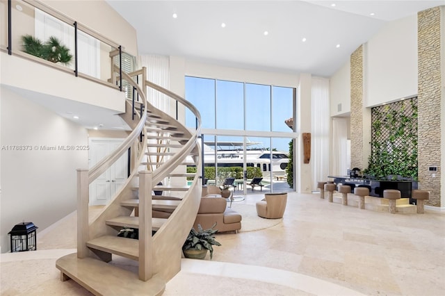 600 Isle Of Palms Dr, Fort Lauderdale, FL 33301 - stairs with high vaulted ceiling and recessed lighting