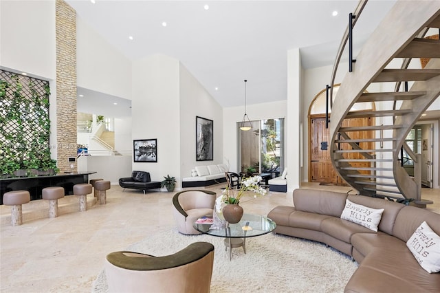 600 Isle Of Palms Dr, Fort Lauderdale, FL 33301 - living area with stairway, high vaulted ceiling, baseboards, and recessed lighting
