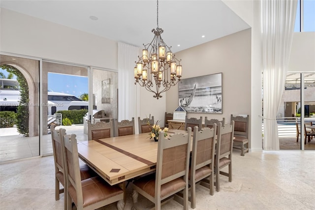 600 Isle Of Palms Dr, Fort Lauderdale, FL 33301 - dining room with an inviting chandelier and a towering ceiling