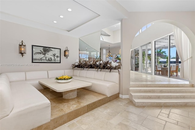 600 Isle Of Palms Dr, Fort Lauderdale, FL 33301 - living area with stone tile flooring, recessed lighting, baseboards, and arched walkways