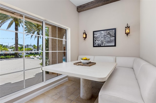 600 Isle Of Palms Dr, Fort Lauderdale, FL 33301 - dining space with stone finish flooring, breakfast area, and beam ceiling