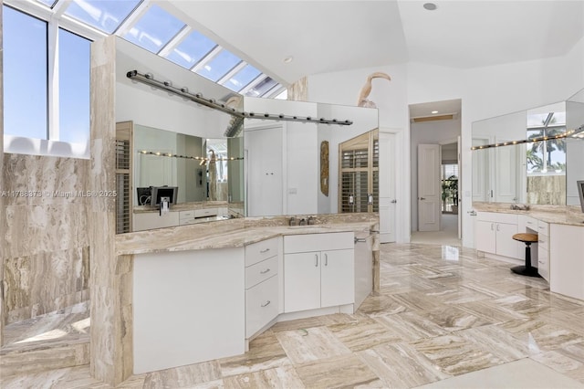 600 Isle Of Palms Dr, Fort Lauderdale, FL 33301 - full bath featuring a sink, walk in shower, two vanities, and high vaulted ceiling