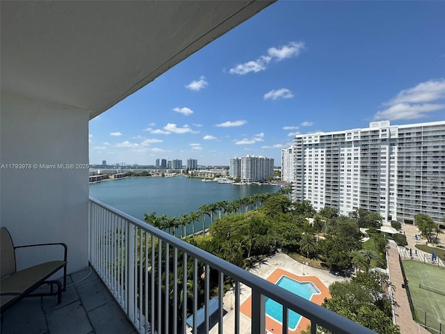 balcony with a view of city and a water view