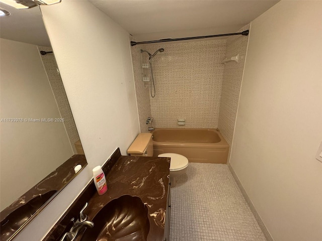 bathroom featuring tile patterned floors, toilet, and shower / washtub combination