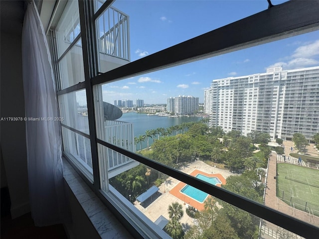 balcony featuring a view of city and a water view