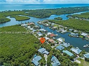 10737 SE Seaspray Ct, Hobe Sound, FL 33455 - aerial view of residential area featuring a large body of water