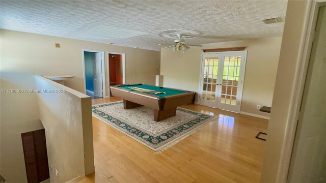 10737 SE Seaspray Ct, Hobe Sound, FL 33455 - rec room with french doors, wood finished floors, ceiling fan, a textured ceiling, and billiards