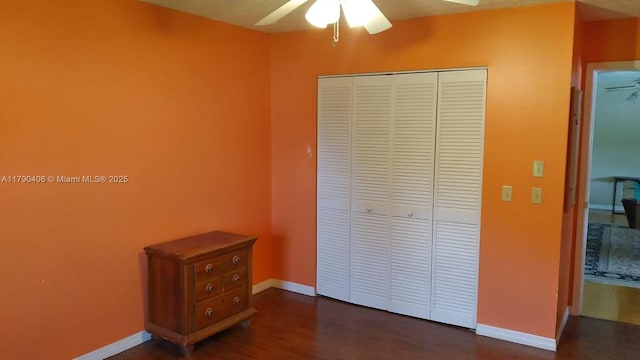 10737 SE Seaspray Ct, Hobe Sound, FL 33455 - unfurnished bedroom with a closet, dark wood finished floors, and ceiling fan