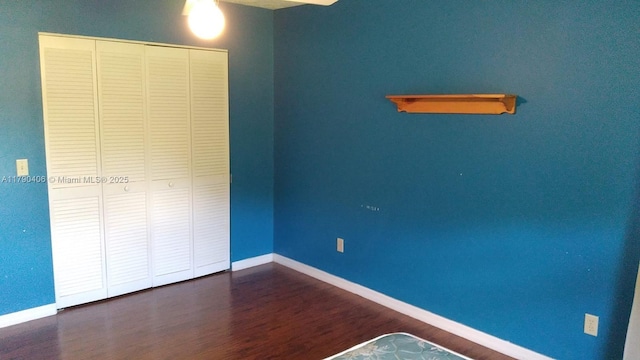 10737 SE Seaspray Ct, Hobe Sound, FL 33455 - unfurnished bedroom featuring wood finished floors and a closet