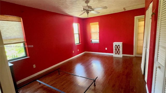 10737 SE Seaspray Ct, Hobe Sound, FL 33455 - unfurnished bedroom featuring wood finished floors and a ceiling fan