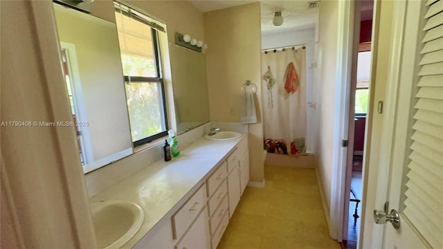 10737 SE Seaspray Ct, Hobe Sound, FL 33455 - full bathroom with double vanity and plenty of natural light