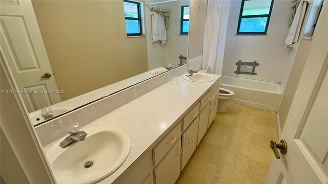 10737 SE Seaspray Ct, Hobe Sound, FL 33455 - full bath with plenty of natural light, double vanity, shower / bath combination with curtain, and tile patterned floors