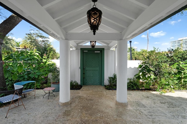 doorway to property with a patio area