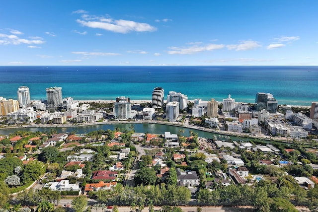 birds eye view of property with a view of city and a water view