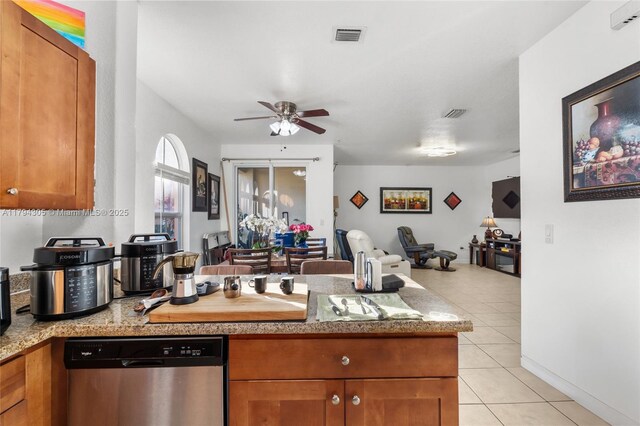 10012 NW 7th St Unit 107, Miami, FL 33172 - kitchen with dishwasher, light tile patterned flooring, ceiling fan, brown cabinets, and open floor plan