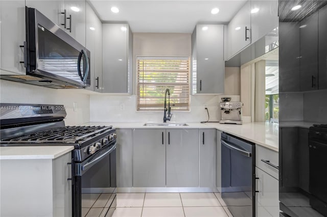 6501 Scott St, Hollywood, FL 33024 - kitchen featuring a sink, appliances with stainless steel finishes, plenty of natural light, and light countertops