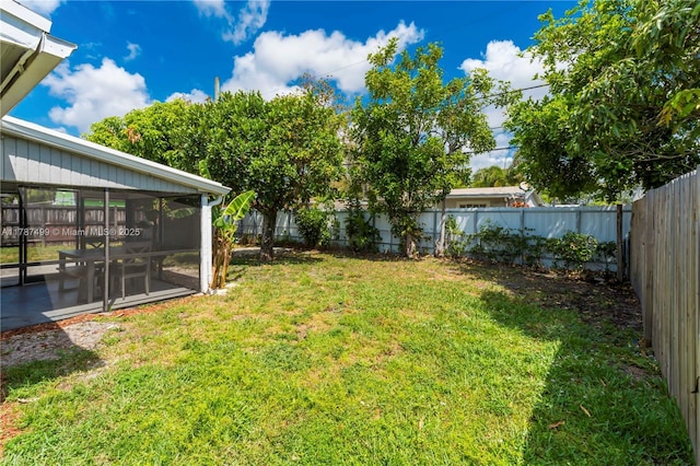 6501 Scott St, Hollywood, FL 33024 - view of yard featuring a sunroom and a fenced backyard