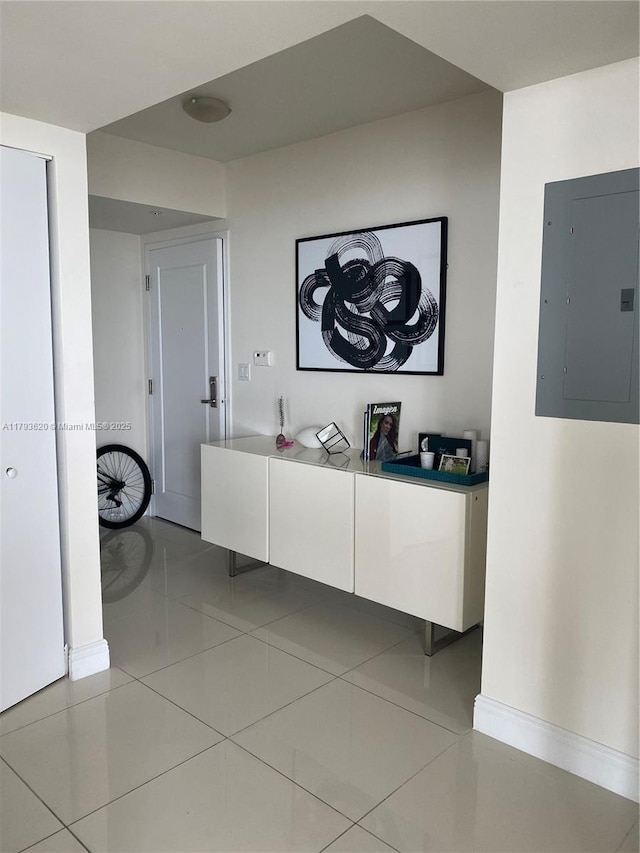 1871 NW S River Dr Unit 903, Miami, FL 33125 - corridor with baseboards, light tile patterned floors, and electric panel