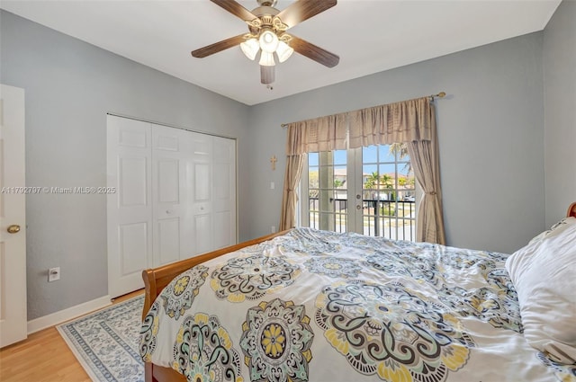 22221 SW 87th Pl, Cutler Bay, FL 33190 - bedroom with ceiling fan, wood finished floors, baseboards, a closet, and access to outside