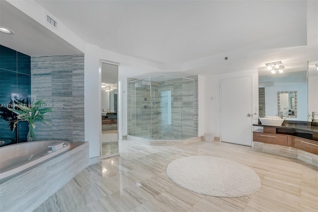 101 S Fort Lauderdale Beach Blvd Unit 308, Fort Lauderdale, FL 33316 - bathroom featuring a stall shower, a garden tub, vanity, and tile patterned flooring